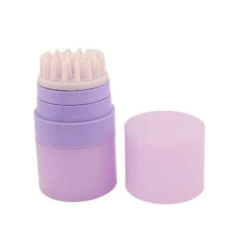 a 30ml rotary airless bottle featuring a silicone-bristle brush applicator. The twist-lock mechanism is shown in the open position, demonstrating the precision dispensing port centered within the exfoliating bristles.