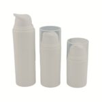A tiered set of white matte PP airless pump bottles in 15ml, 30ml, and 50ml sizes. The minimalist design highlights a professional, sustainable, and cohesive skincare packaging line.