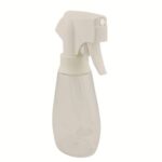 sleek 10 oz (300 ml) white continuous spray bottle with an ergonomic trigger head. The design shows a modern, propellant-free mister used in professional hair salons.