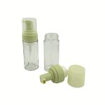 A 90 ml clear glass cylinder bottle with a white foaming pump head. The sleek, vertical design and high-clarity glass showcase a professional solution for premium skincare brands.