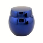 A 1.69 oz (50 g) clear glass jar with a perfect spherical shape and a heavy glass base. The jar is topped with a minimalist silver domed cap, reflecting a modern and sculptural luxury aesthetic.