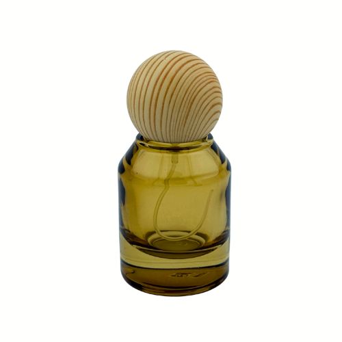 A 1 oz clear rectangular glass perfume bottle with a light oak wooden cap and a gold fine-mist atomizer.